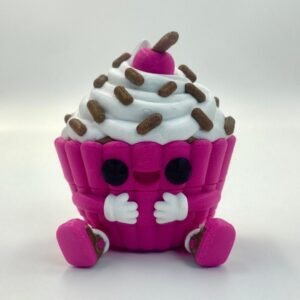 Pink articulated cupcake keychain with white frosting and sprinkle details