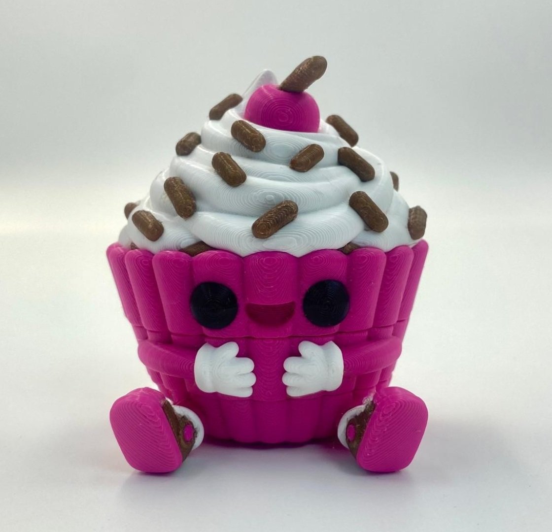 Tutcra — Fresh Homepage Pink articulated cupcake keychain with white frosting and sprinkle details