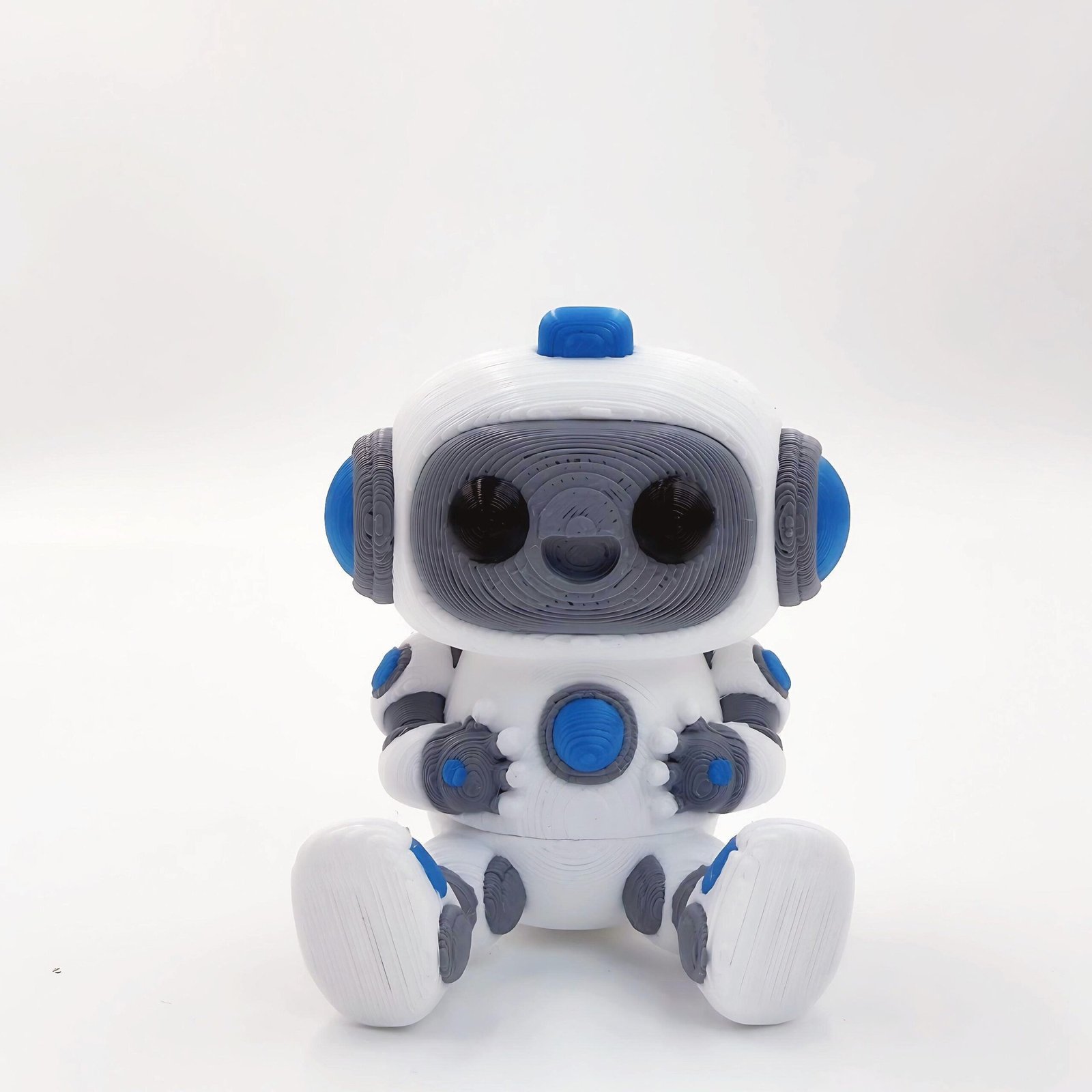 tutcra flexy3d robot keychain 1 White, gray and blue articulated robot keychain, front view