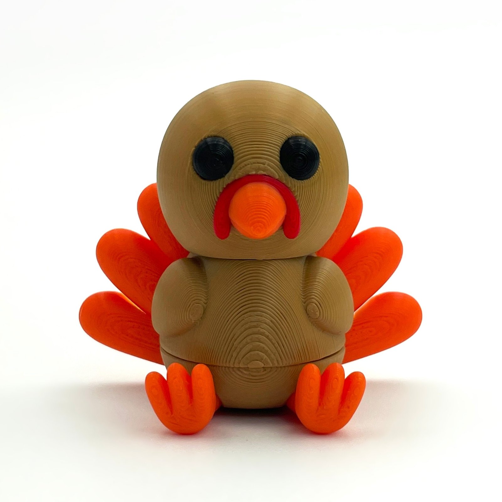 tutcra flexy3d turkey keychain 1 Brown and orange articulated turkey keychain, front view