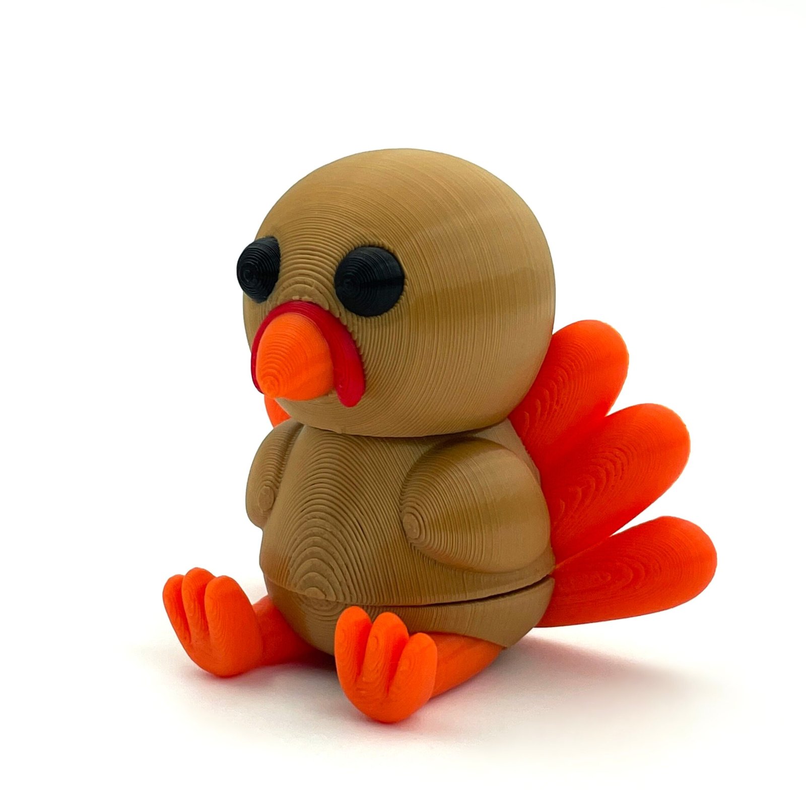 tutcra flexy3d turkey keychain 2 Brown and orange articulated turkey keychain, side view