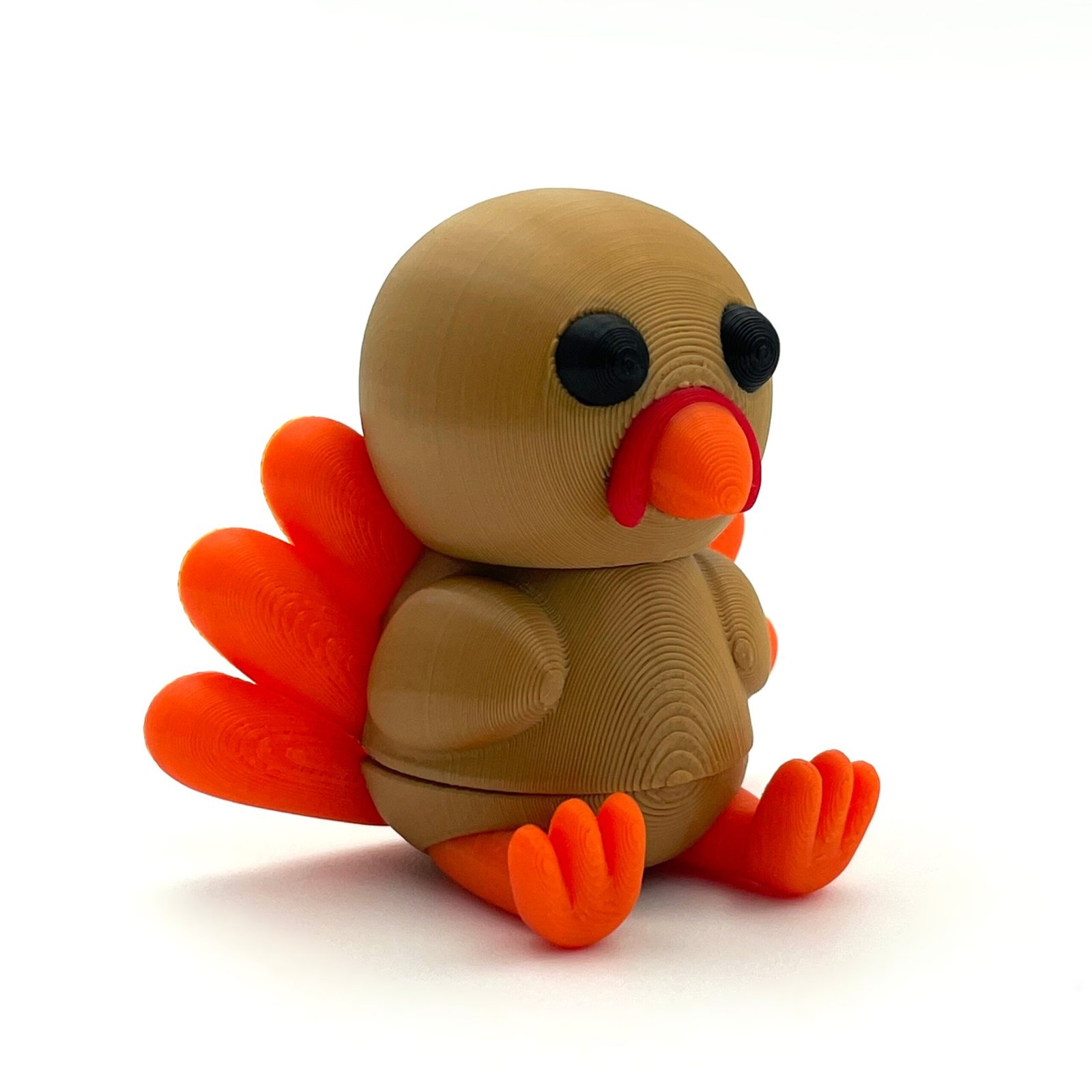 tutcra flexy3d turkey keychain 3 Brown and orange articulated turkey keychain, opposite side view